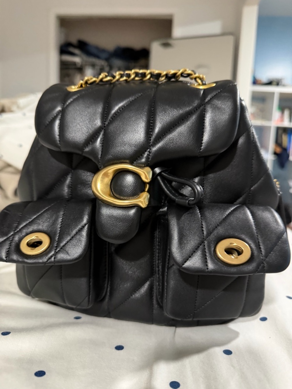 Black Quilted Leather Backpack with Gold Hardware